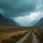 A breathtaking panoramic view of Iota Valley, showcasing lush green hills, winding rivers, and vibrant wildflowers under a clear blue sky.