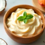 Bowl of soymamicoco blend with soybeans coconut and mamey sapote on wooden surface