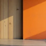 Acamento finishing process showing raw wood metal and painted surfaces transformed into polished quality materials with protective coatings