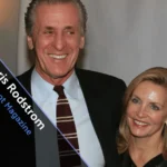 Chris Rodstrom smiling beside Pat Riley at a sports event.