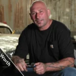 Ian Roussel working on custom car build in Full Custom Garage shop