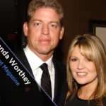 Rhonda Worthey smiling during a public event in elegant attire.