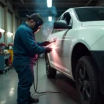 Ausbeulstation dent repair equipment with spot welder and pulling bridge in auto body shop