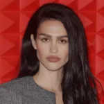 Who is Amelia Gray Hamlin model walking runway at fashion week wearing designer clothing for luxury brand campaign