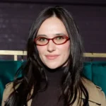 Who is Devon Lee Carlson - LA fashion influencer and Wildflower Cases co-founder in signature Y2K streetwear outfit.