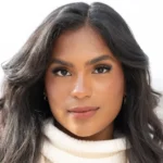 Monet McMichael smiling, a registered nurse and successful TikTok creator filming a Get Ready With Me video.