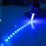 Uvlack UV coating being applied to surface with LED lights creating durable scratch-resistant glossy protective layer