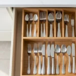14x18 cutlery tray two tier in open drawer with organized forks, spoons and knives