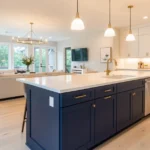 Open concept kitchen with navy island and brass hardware—House Renovation Heartomenal design.