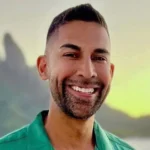 Dhar Mann YouTube creator and entrepreneur standing in his studio