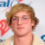 Logan Paul WWE wrestler posing in ring with championship belt