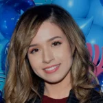 Who is Pokimane - Imane Anys streaming Valorant on Twitch to her 9 million followers from her Los Angeles gaming setup.