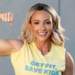 Who is Paige Hathaway posing in gym showing strong physique during workout session.