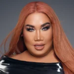 Who is Patrick Starrr, beauty guru and ONE/SIZE founder, wearing bold makeup and representing inclusive beauty.