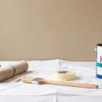 A paint roller applying KWAL Paint 961-246 on a freshly prepped interior wall showing smooth, consistent low-VOC coverage.