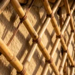 Close-up of oronsuuts, the wooden lattice wall poles of a traditional Mongolian ger tied with leather cord