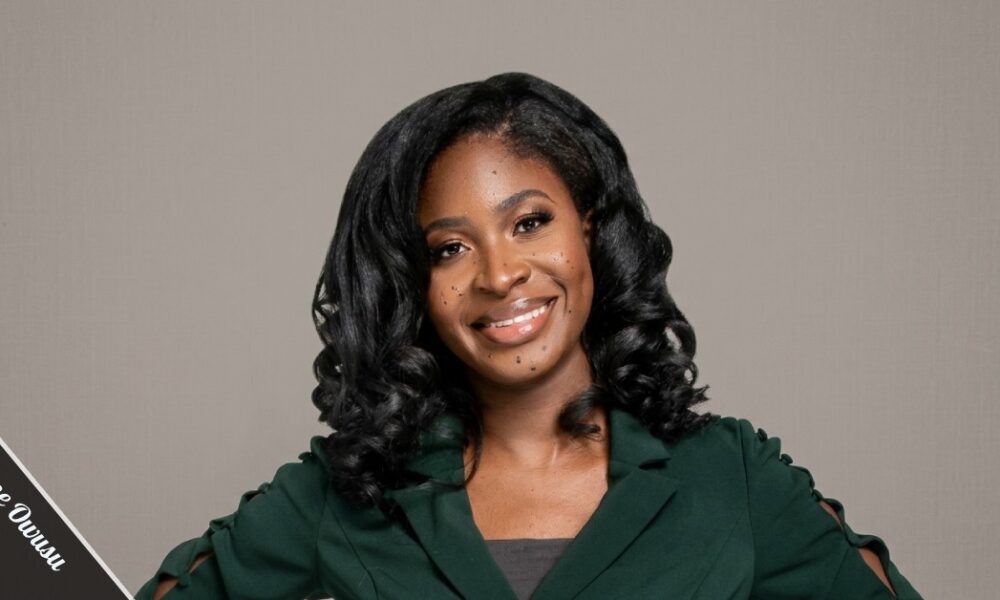 Maxine Owusu emergency medicine doctor and STEM advocate holding a children's book