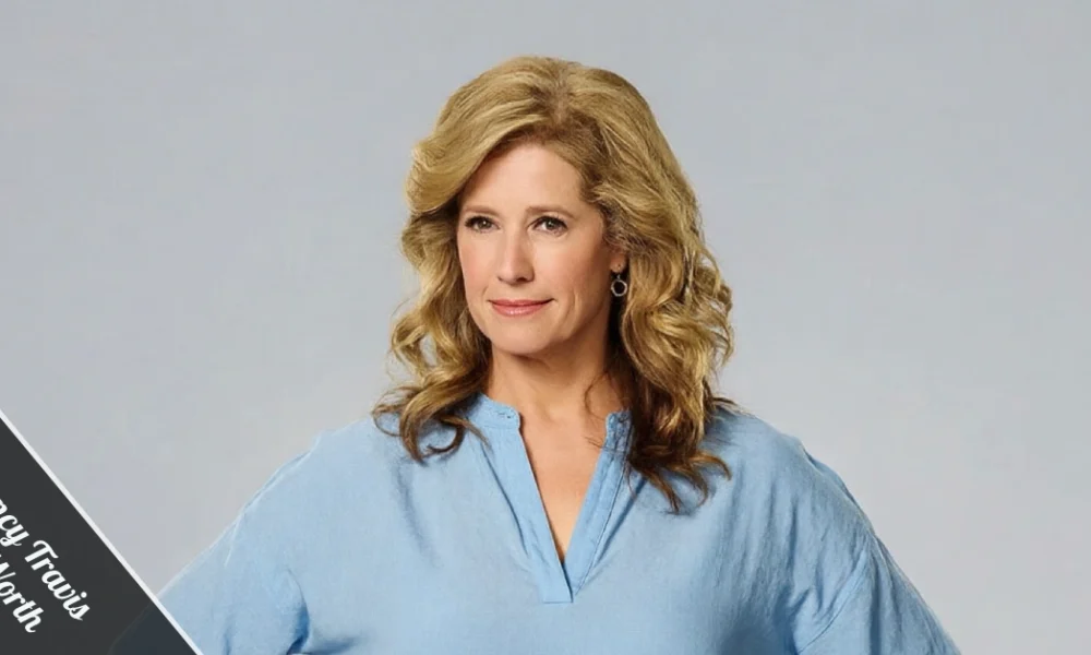 Nancy Travis, mid-50s, smiling in a casual linen blazer on a sunlit Brentwood patio, embodying the quiet confidence behind her $5 million net worth.