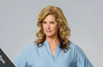 Nancy Travis, mid-50s, smiling in a casual linen blazer on a sunlit Brentwood patio, embodying the quiet confidence behind her $5 million net worth.